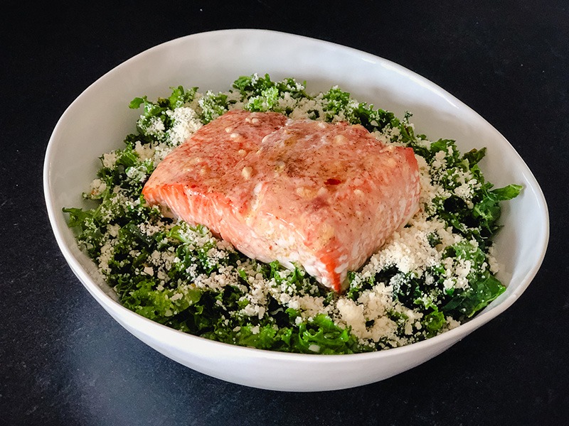 A picture of the dish titled True Food Markinated Kale & Salmon Salad